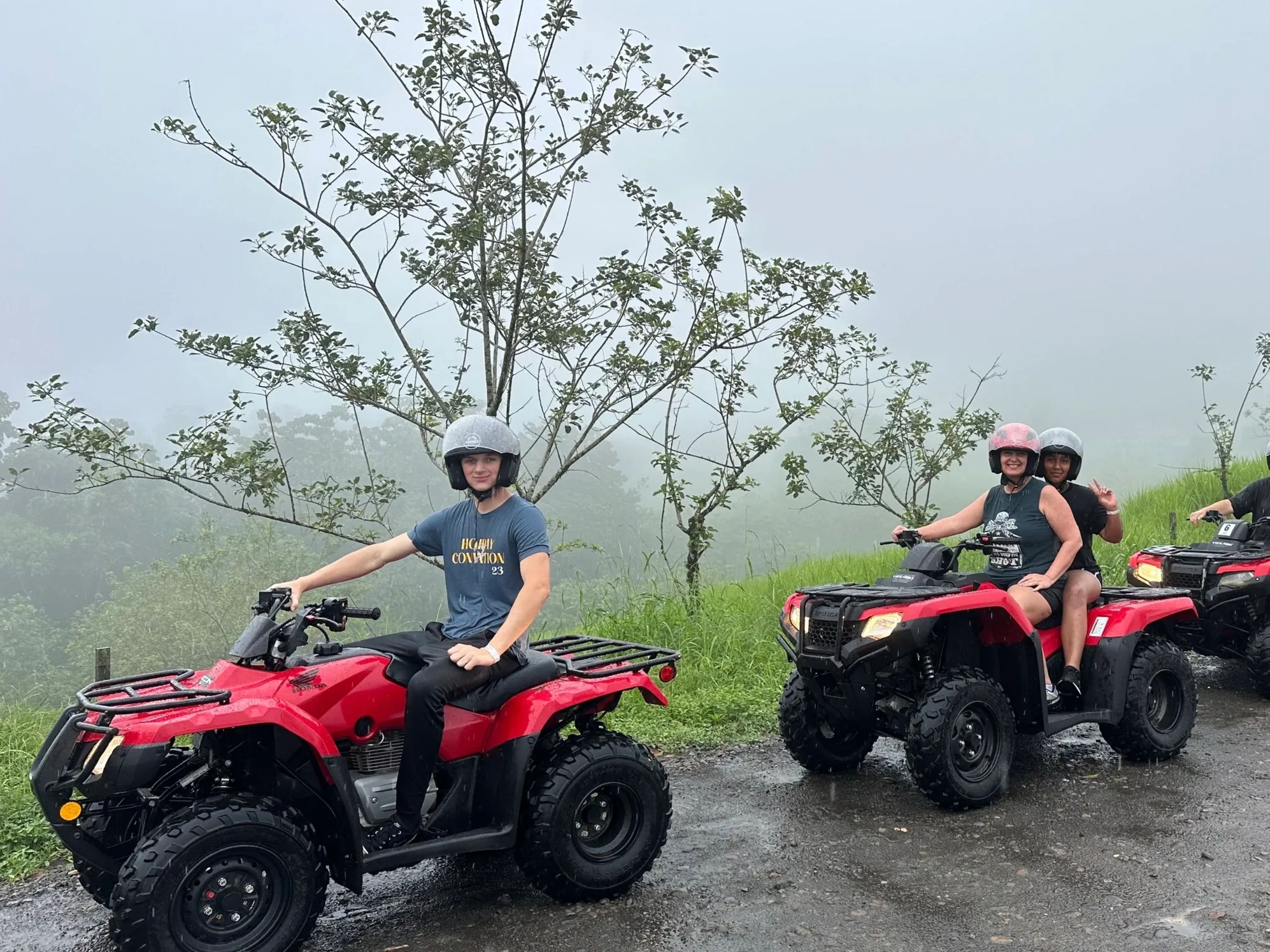 Group riding ATVs outdoors